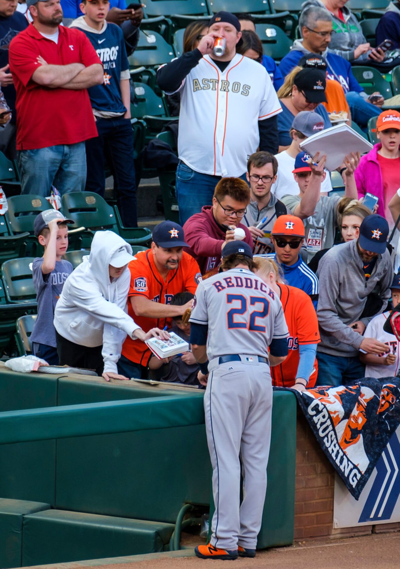 Houston Astros right fielder Josh Reddick signs autographs before a game against the Texas...