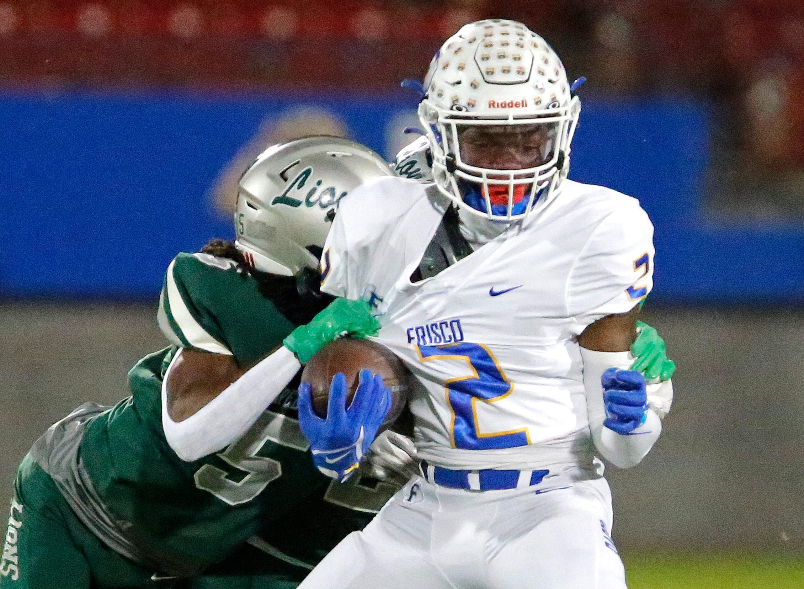 Frisco High School kick returner Ismael Taylor (2) is tackled by Reedy High School defensive...