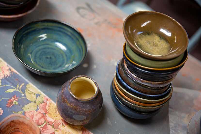 A stack of completed bowls sits in Bill Reed’s upstairs home studio in Denton. Reed took up...