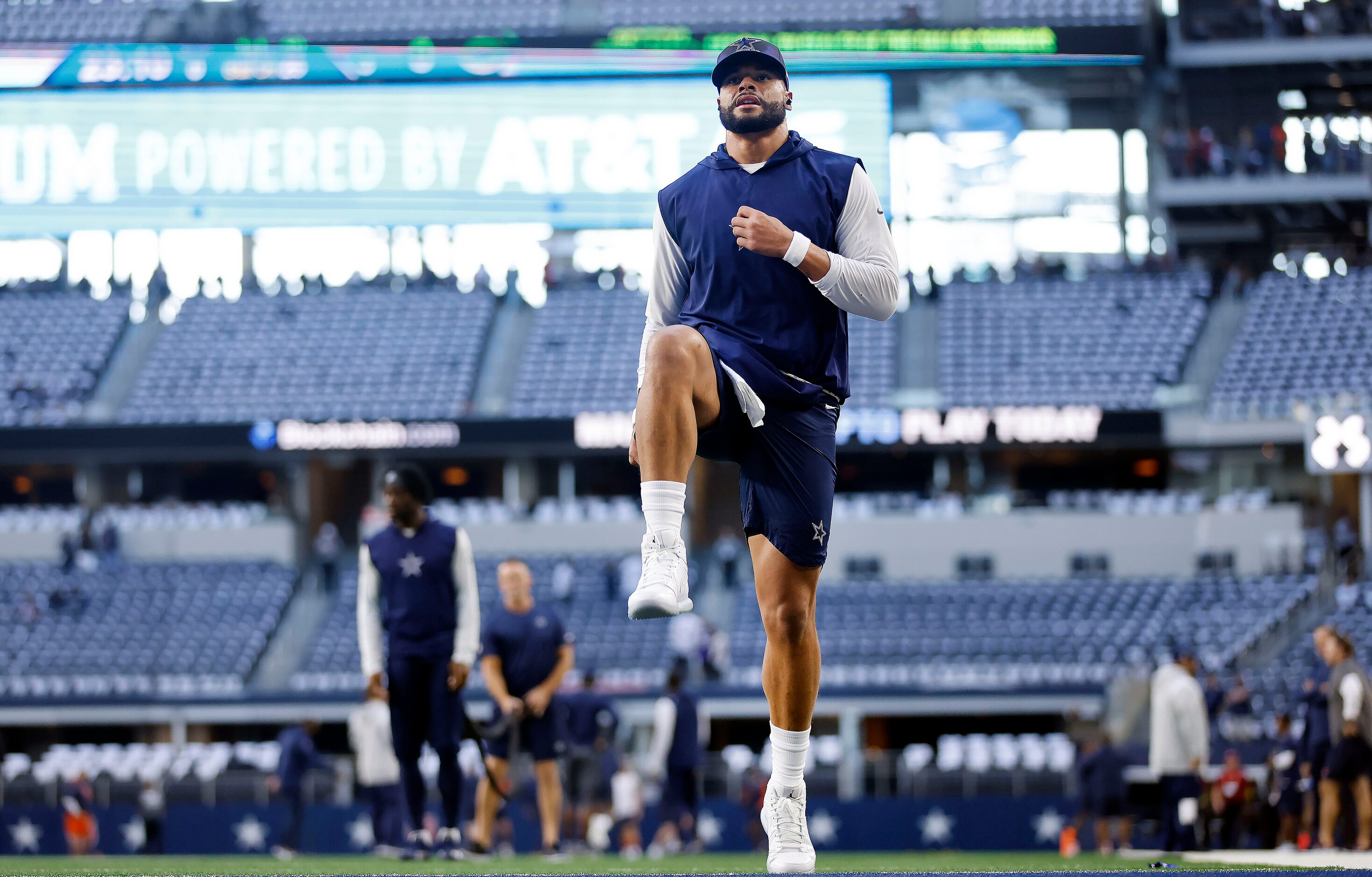 Dallas Cowboys quarterback Dak Prescott (4) stretches before their game against the Chicago...