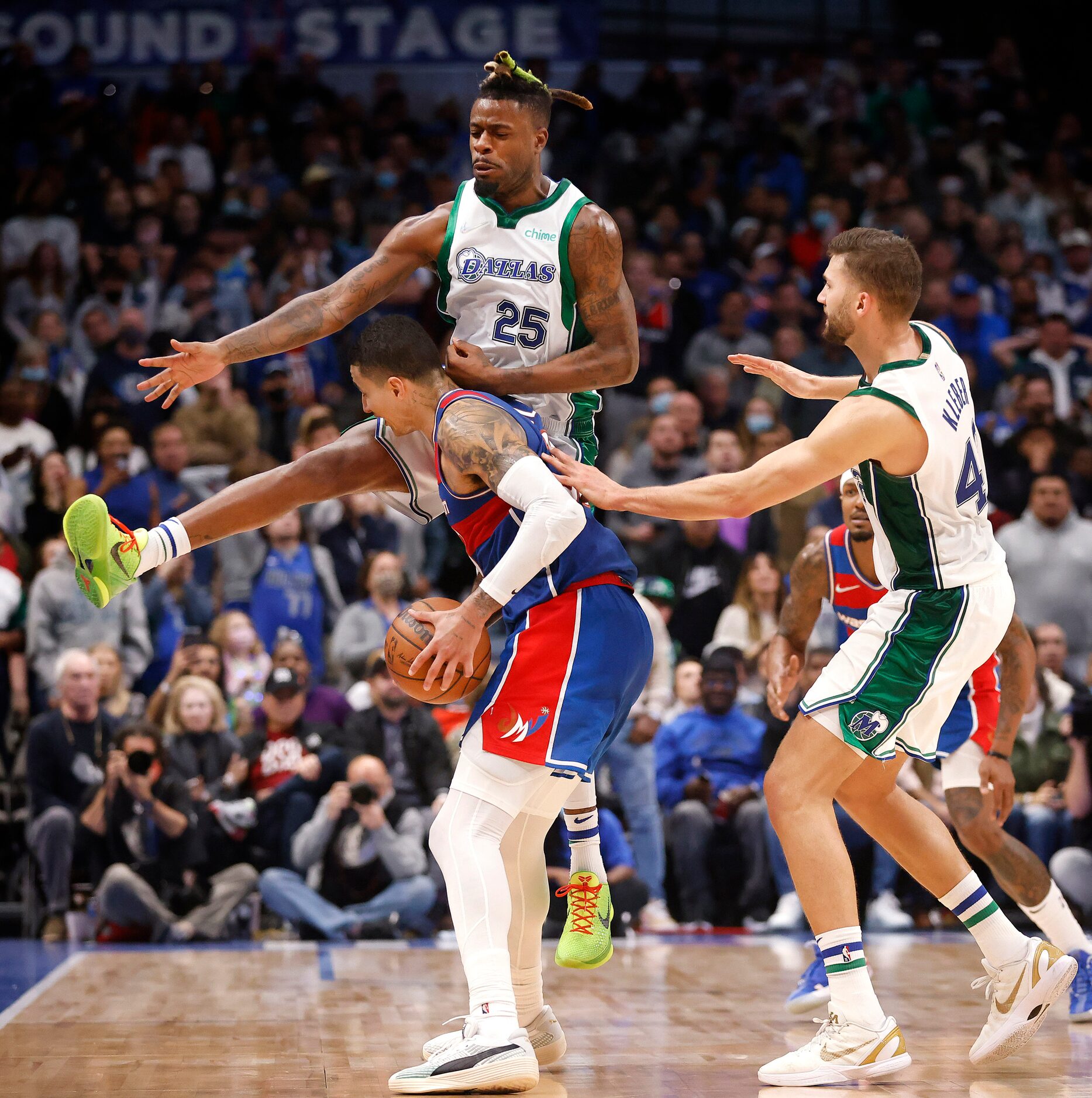 Dallas Mavericks forward Reggie Bullock (25) joins forward Maxi Kleber (42) on a double team...