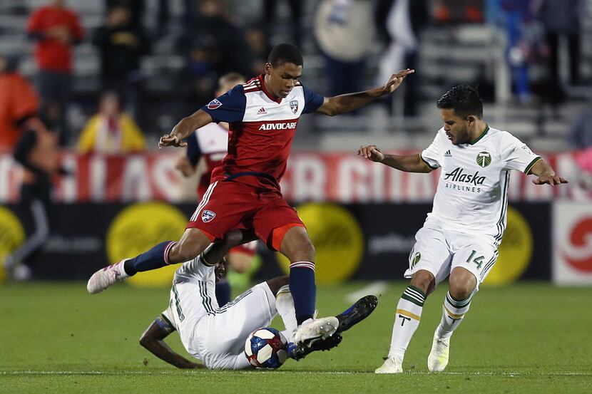 Frisco, Texas: Reggie Cannon #2 of FC Dallas fight the ball during game between FC Dallas...