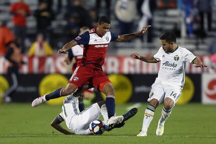 Frisco, Texas: Reggie Cannon #2 of FC Dallas fight the ball during game between FC Dallas...