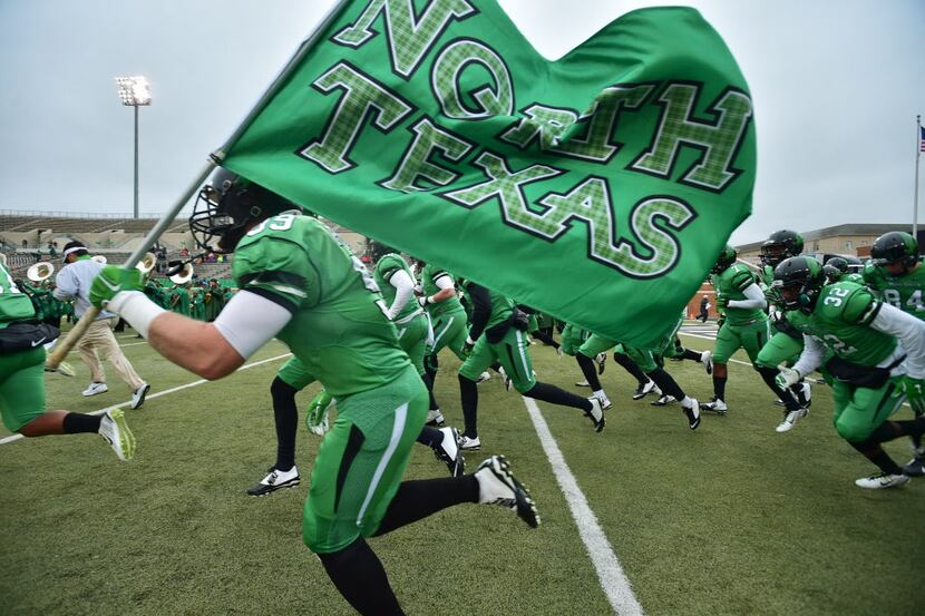 The North Texas Mean Green take the field before kickoff against Texas-El Paso, Saturday,...
