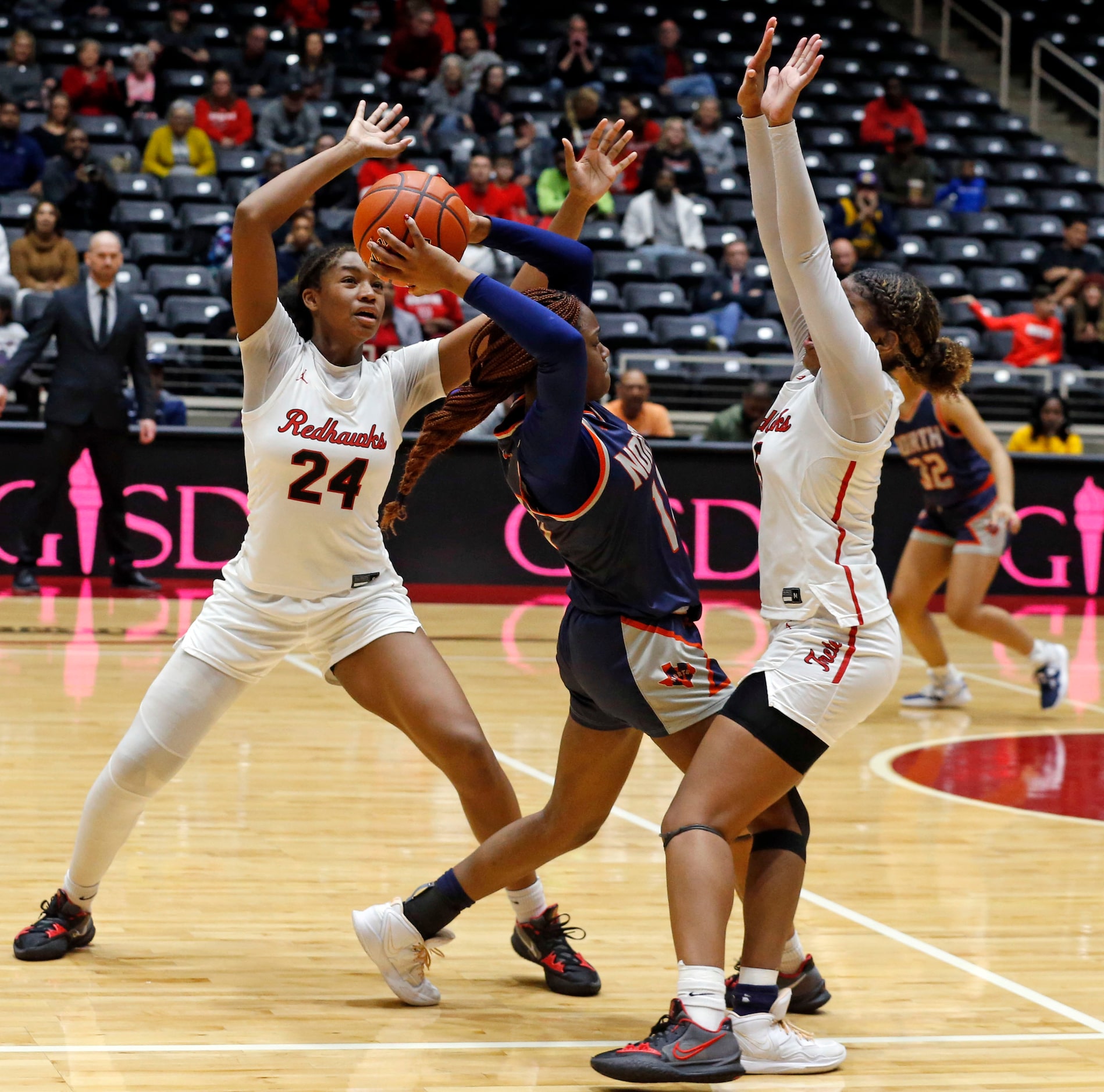 Frisco Liberty High’s G Jacy Abii (24) and G Keyera Roseby (5) pressure McKinney North...