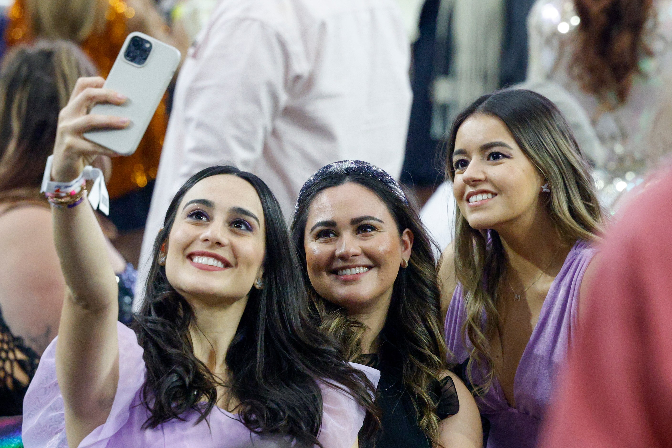 Fans take a selfie before Taylor Swift takes the stage for the Eras Tour concert at AT&T...