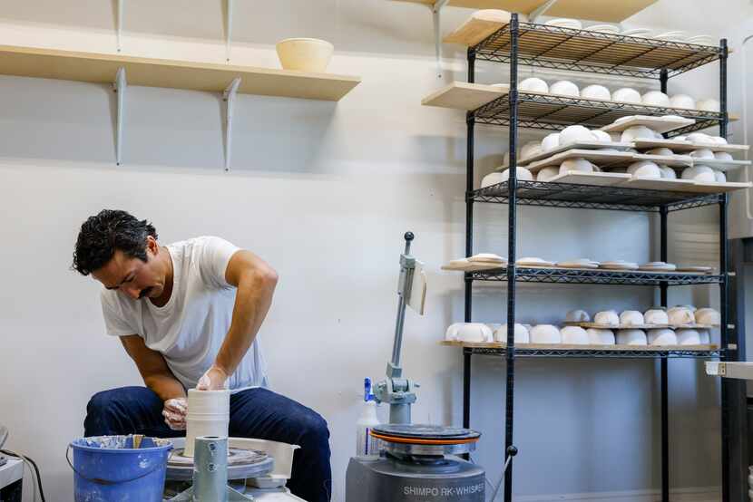 Ceramic artist Marcello Andres works with clay at his Dallas studio. He says he's learned...
