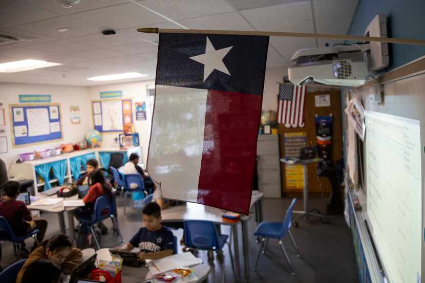 A Texas and American flag in fifth grade teacher Mr. Mejicanos classroom at the Bowie Fine...