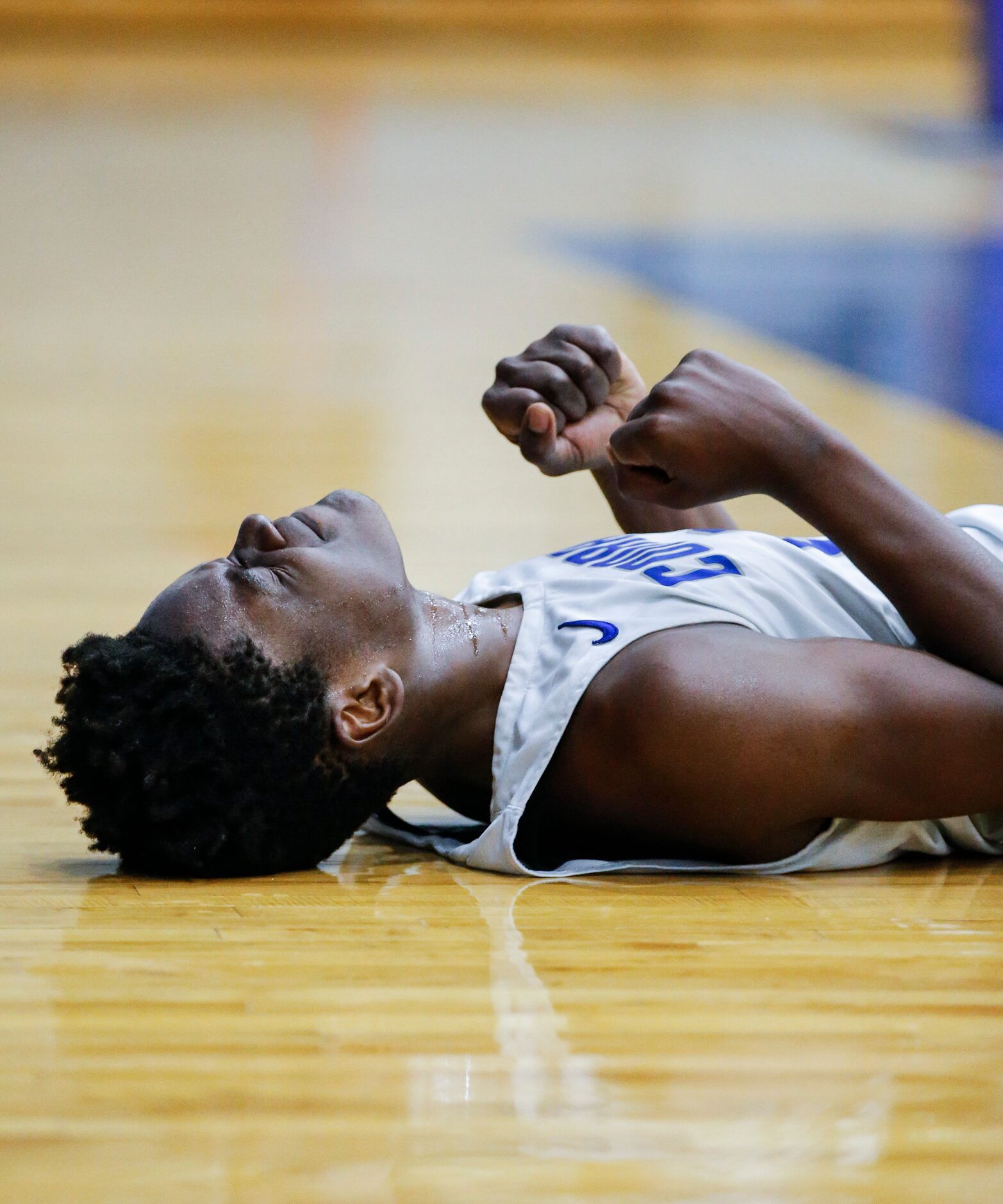 Conrad senior forward Joe Joe Yelegayhee (0) reacts to drawing a foul against Woodrow Wilson...