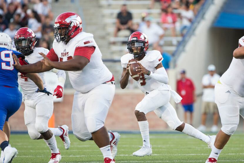 Mesquite Horn quarterback Jermaine Givens (3) looks for an opening to make a pass during a...