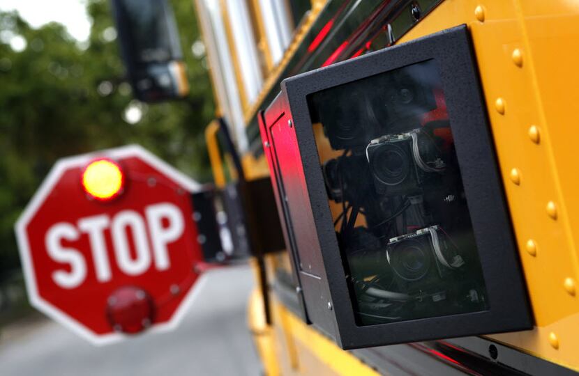 This 2010 photo shows a new Dallas County Schools bus with cameras to catch drivers who fail...