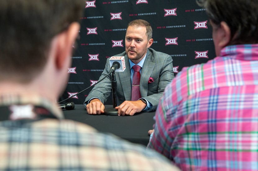 University of Oklahoma head football coach Lincoln Riley speaks with reporters during the...