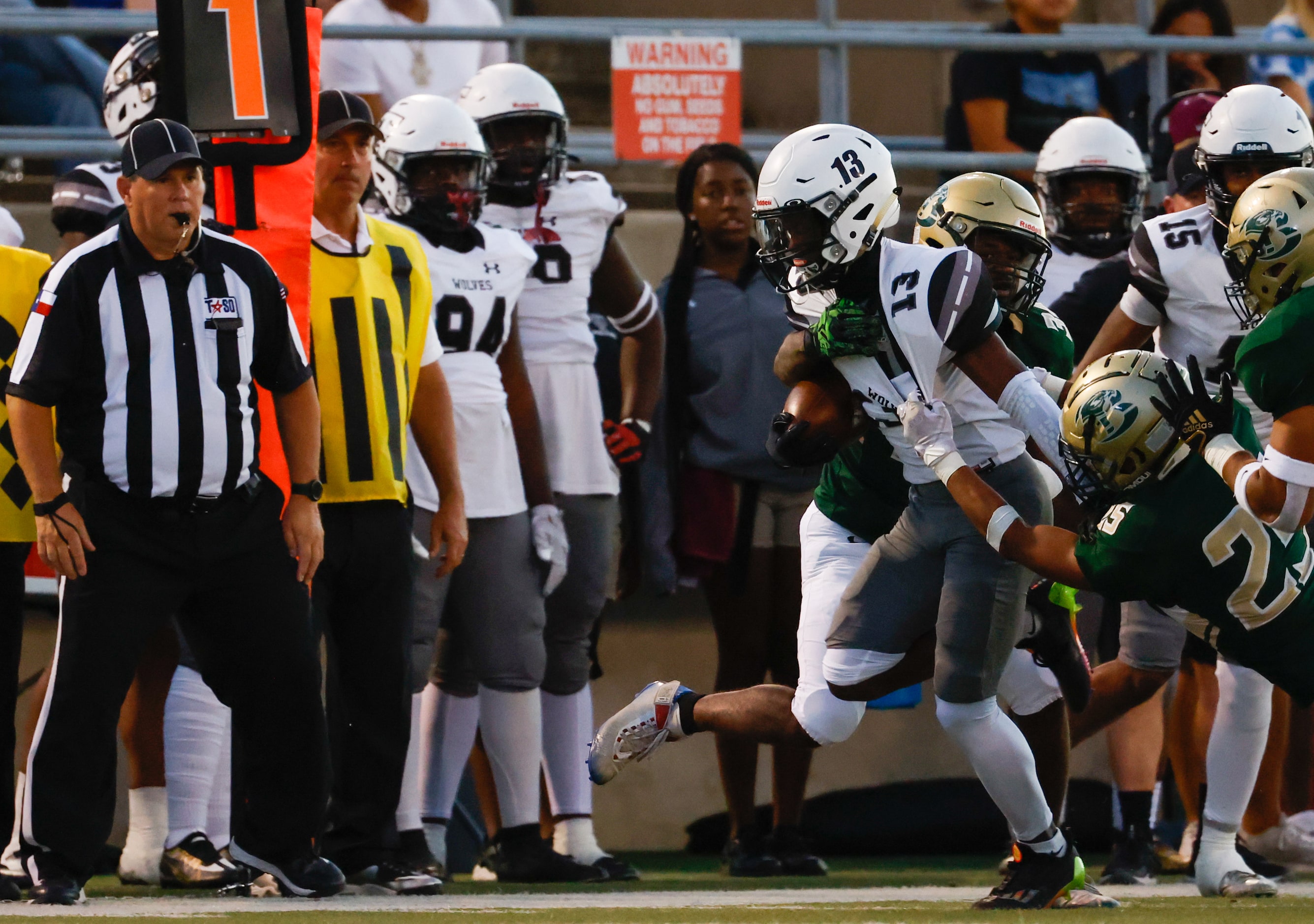 Birdville defensive back Arturo Rodriguez (25) pulls on Mansfield Timberview wide receiver...