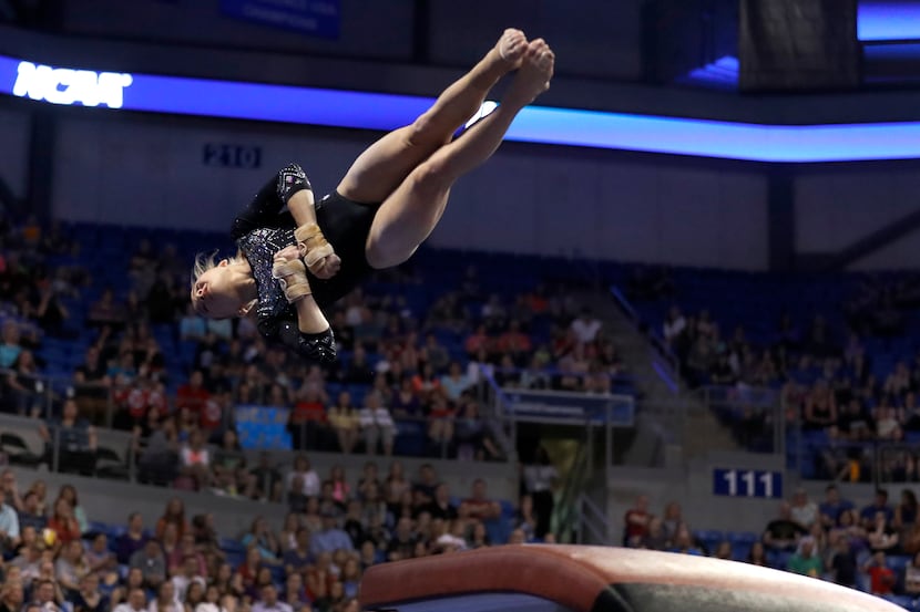 FILE - UCLA's Madison Kocian competes on the vault during the NCAA college women's...