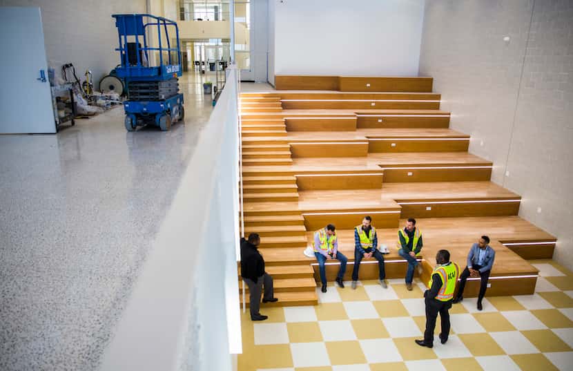 Workers chat in a main hallway and seating area on Thursday, December 19, 2019 at South Oak...