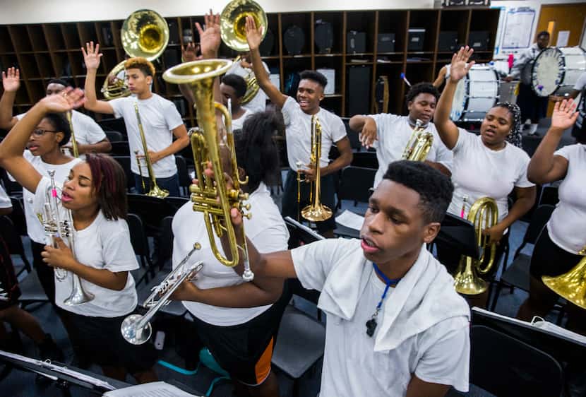 The Wilmer-Hutchins High School band rehearses after school on Nov. 18. The band is made up...
