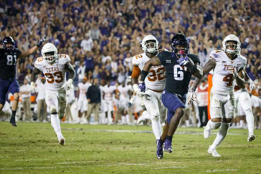 TCU running back Darius Anderson (6) breaks through the Texas defense to score on a 31-yard...