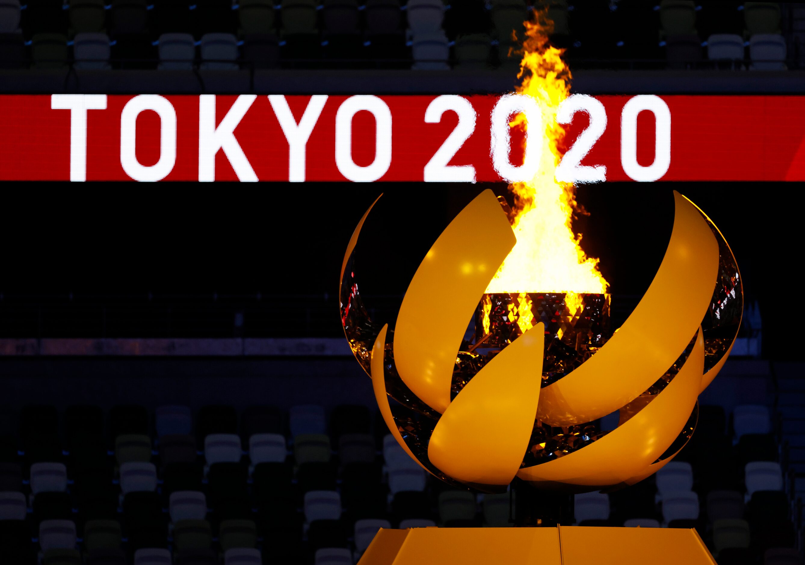 The Olympic cauldron is lit during the opening ceremony for the postponed 2020 Tokyo...