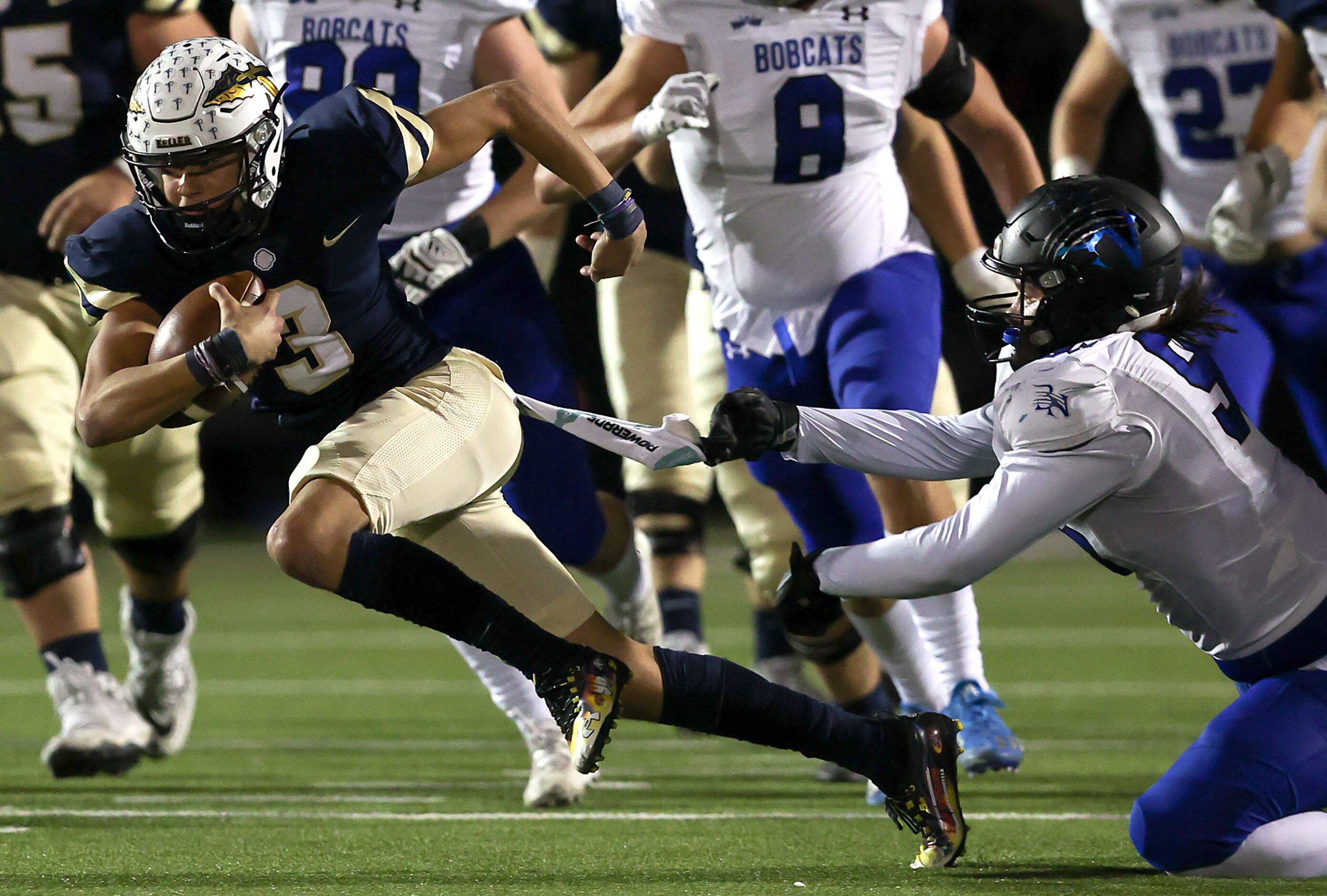 Keller quarterback Tre Guerra (3) tries to elude Byron Nelson defensive lineman Braedon...