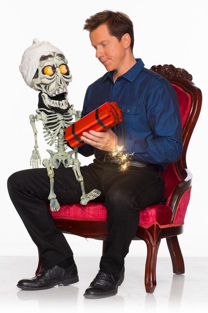 Jeff Dunham, who graduated from Richardson High School, poses with one of  his characters,...