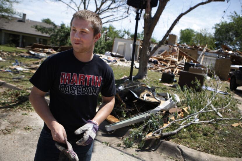 Collin Lawrence, 18, and his family rode out the tornado in their bathroom, the only room in...