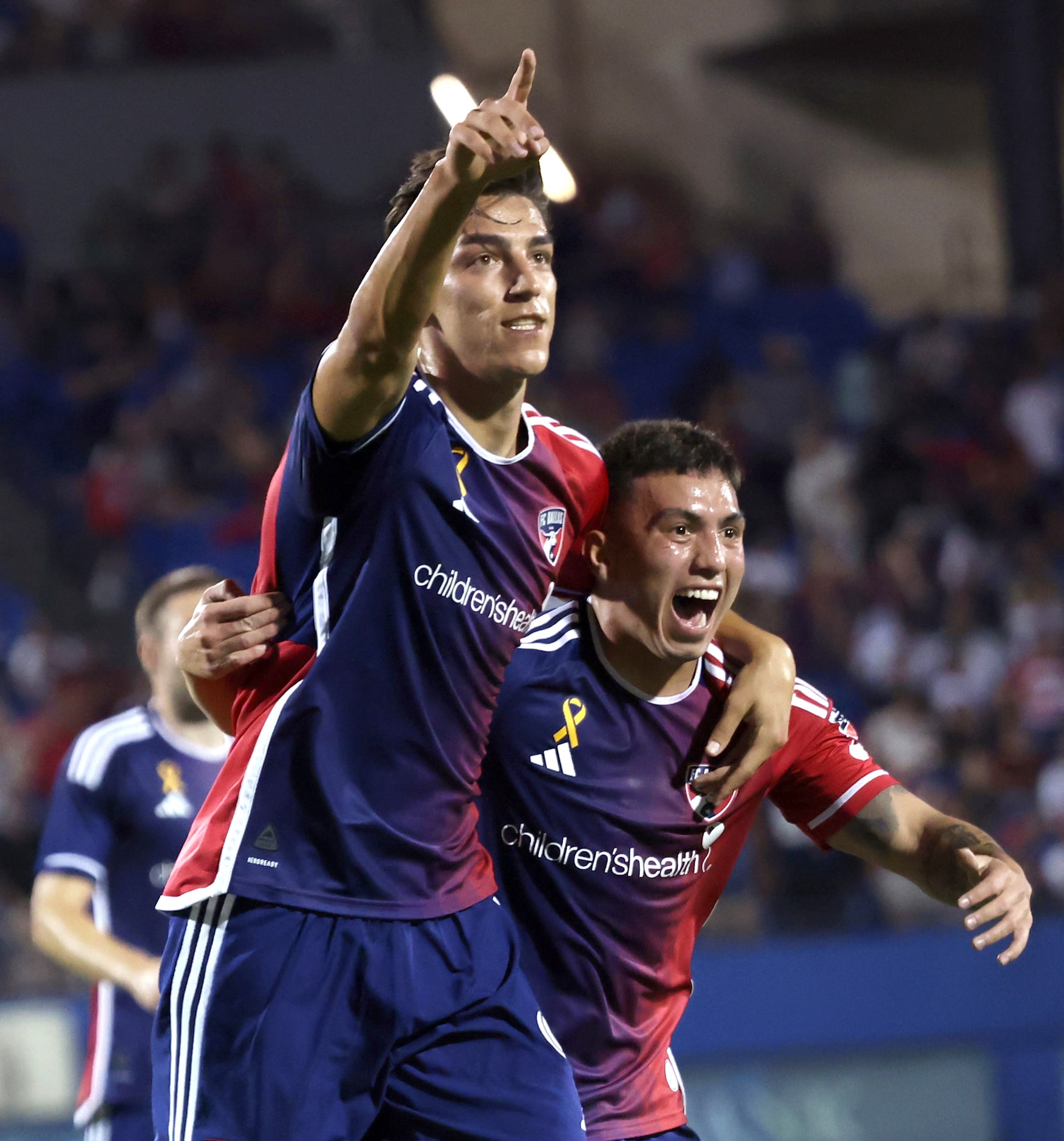 FC Dallas attacker Peter Musa (9), points into the crowd after scoring a goal as he...