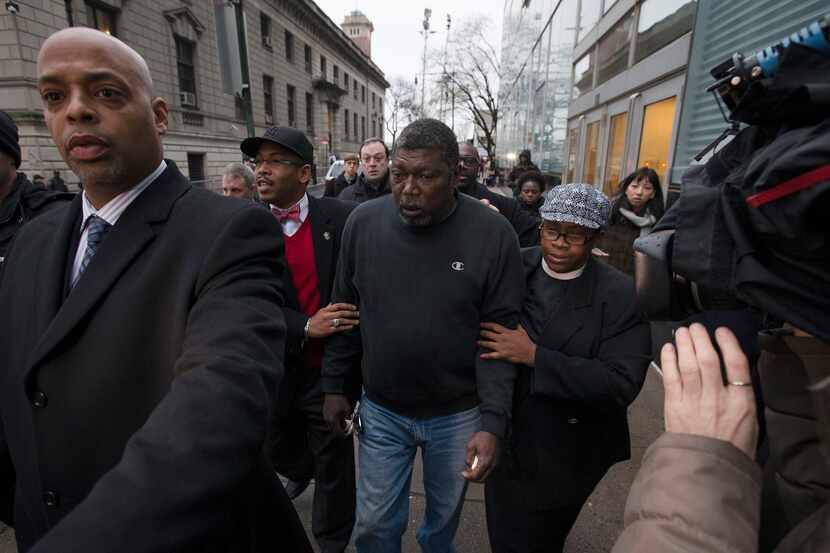 Benjamin Carr, stepfather of Eric Garner, leaves the district attorney's office after a...