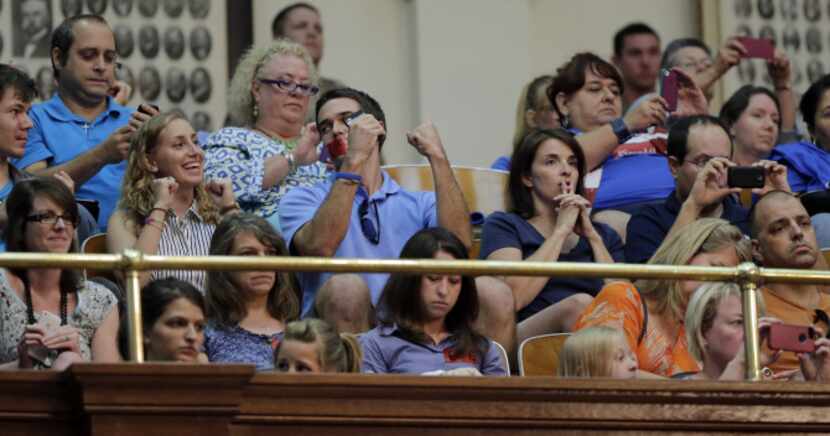 Supporters of new abortion restrictions celebrated in the House gallery Tuesday after the...