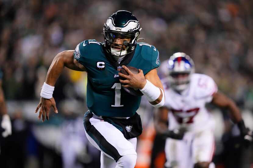 Philadelphia Eagles quarterback Jalen Hurts runs for a touchdown against the New York Giants...