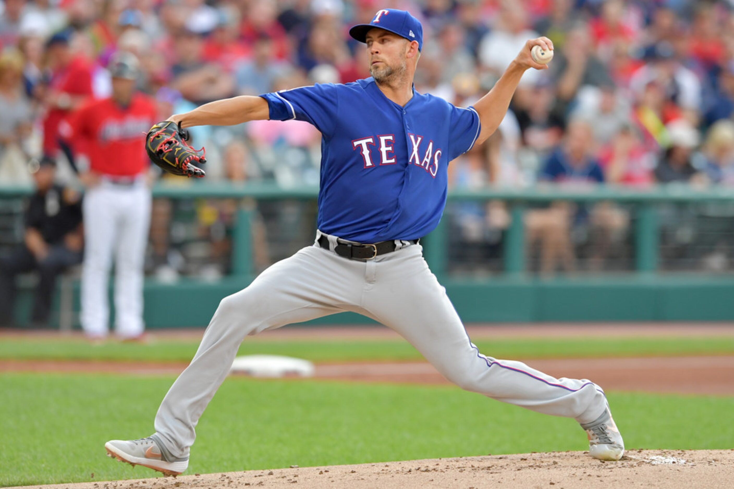 CLEVELAND, OHIO - AUGUST 05: Starting pitcher Mike Minor #23 of the Texas Rangers pitches...