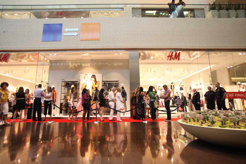 People waited in line for the H&M to open in NorthPark Center on Aug. 17, 2011.