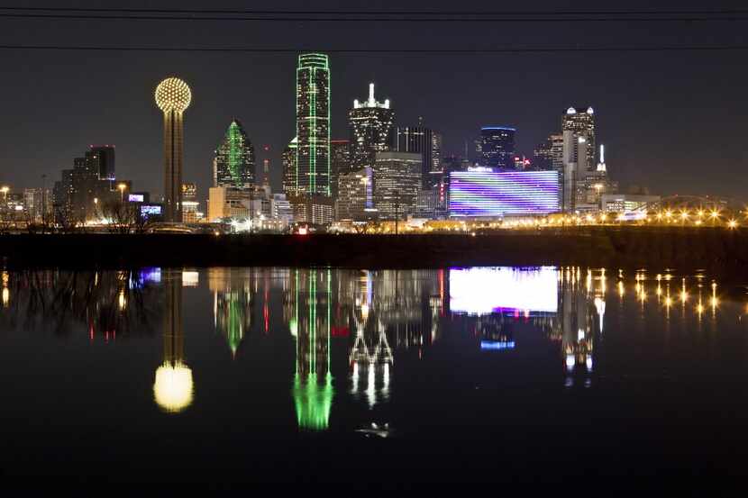 In this  Jan. 26, 2012 file photo, the Dallas skyline is reflected in the Trinity River.