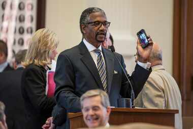  State Rep. Harold Dutton, D-Houston, seen here discussing a texting-while-driving ban...