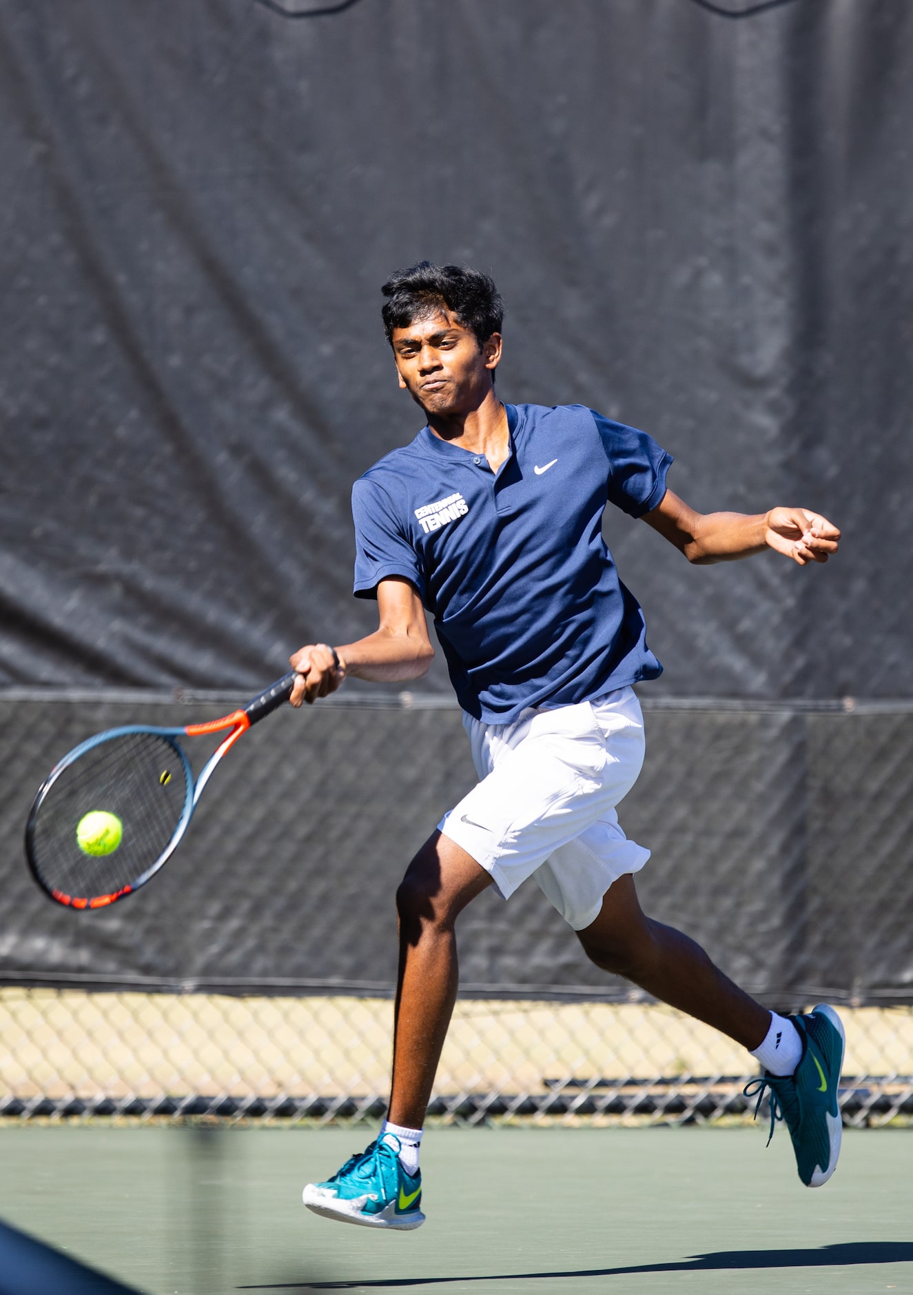 Frisco Centennial’s Shriyan Daggumalli returns a shot during a doubles match with partner...