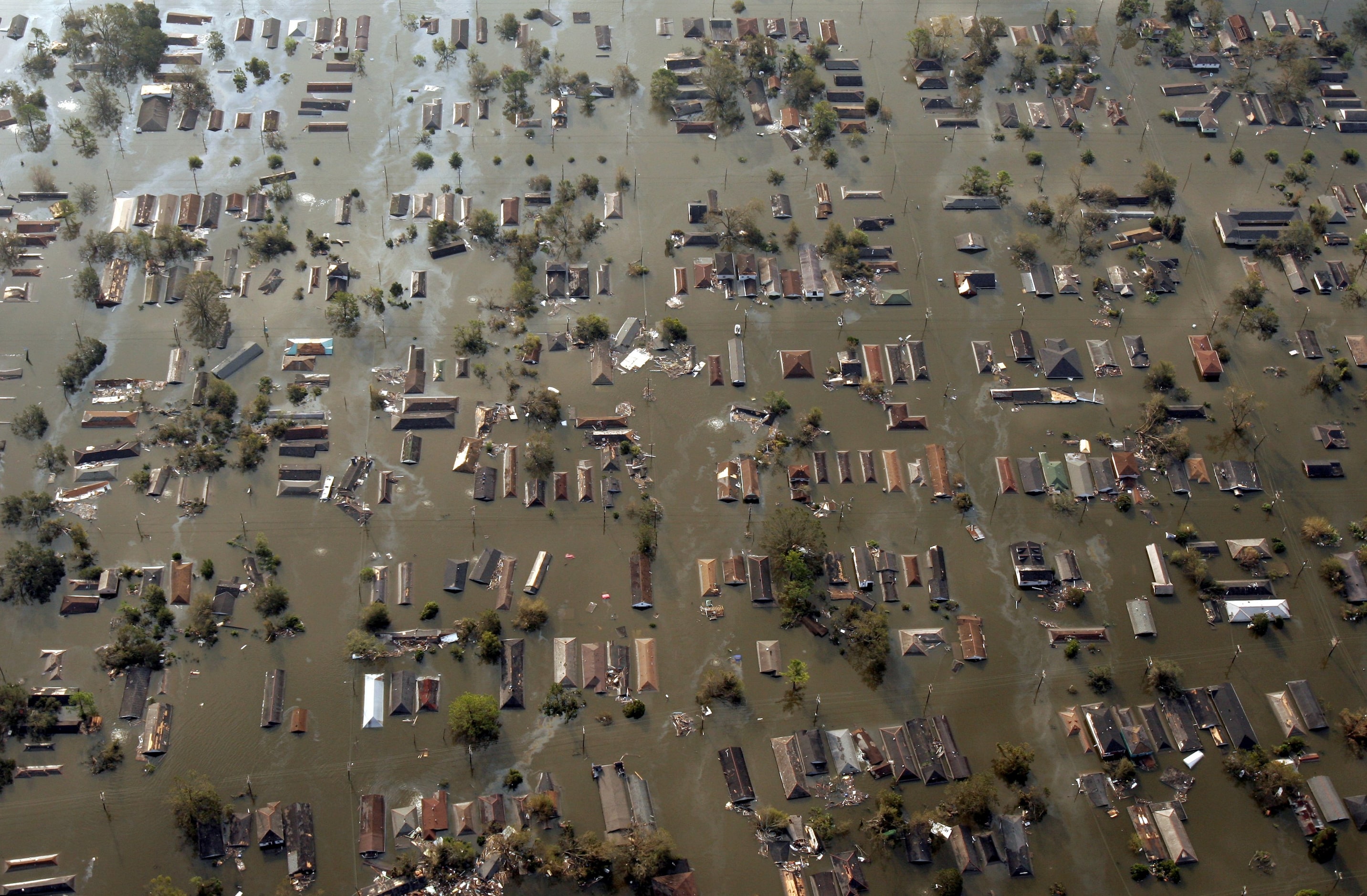 A patchwork of roofs push through the floodwaters east of downtown, one day after Hurricane...