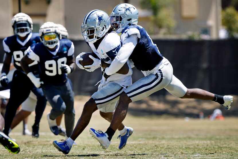Dallas Cowboys wide receiver Noah Brown (85) hangs onto a pass as he’s covered by cornerback...