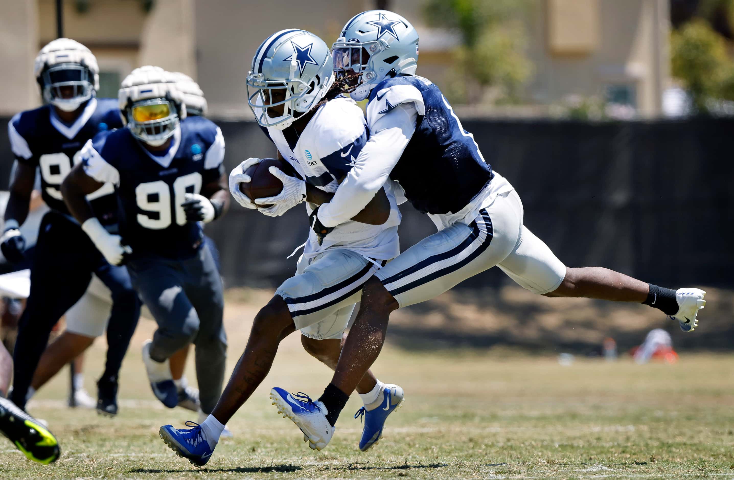 Dallas Cowboys wide receiver Noah Brown (85) hangs onto a pass as he’s covered by cornerback...