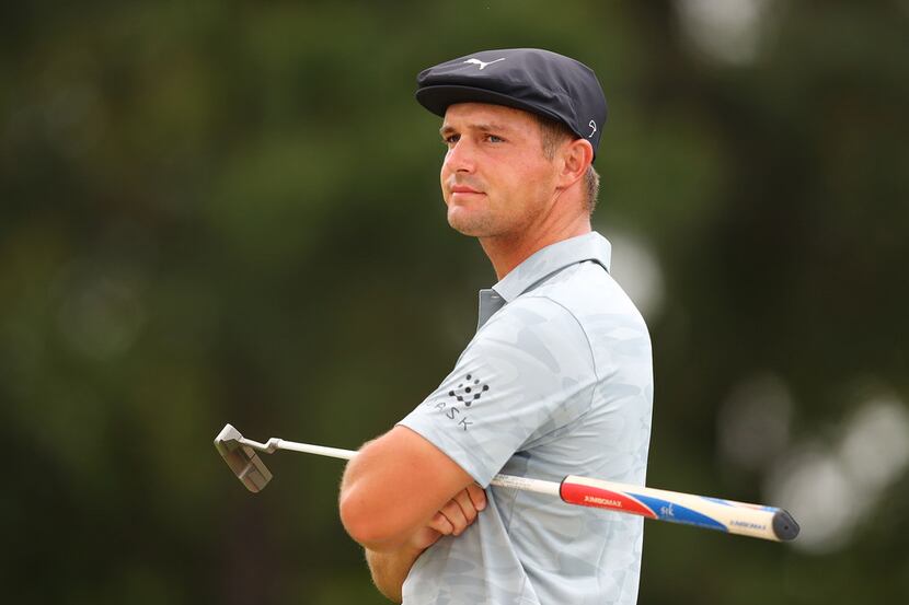 Bryson DeChambeau waits to putt on the 1st green during the second round of the Masters...