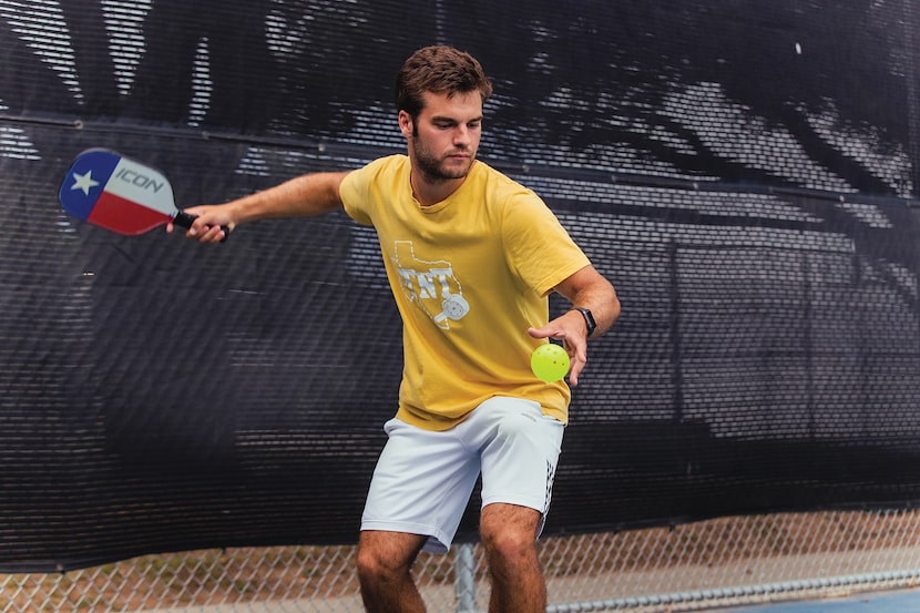 man gets ready to serve in a pickleball game