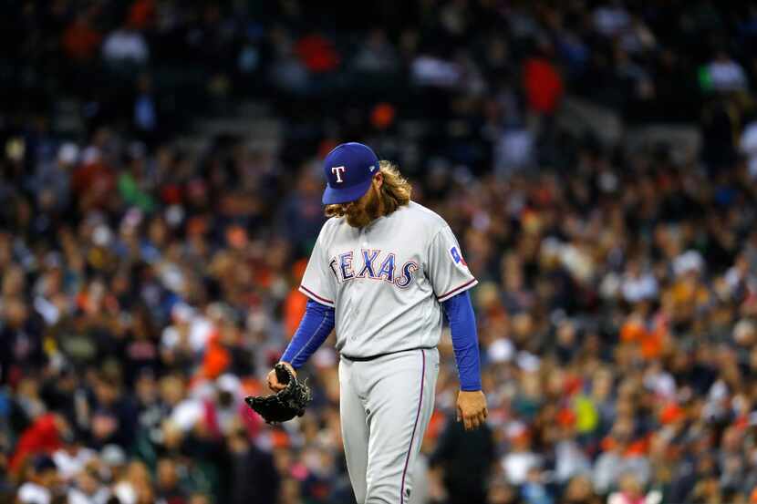 Texas Rangers pitcher A.J. Griffin (64) walks to the dugout against the Detroit Tigers in...