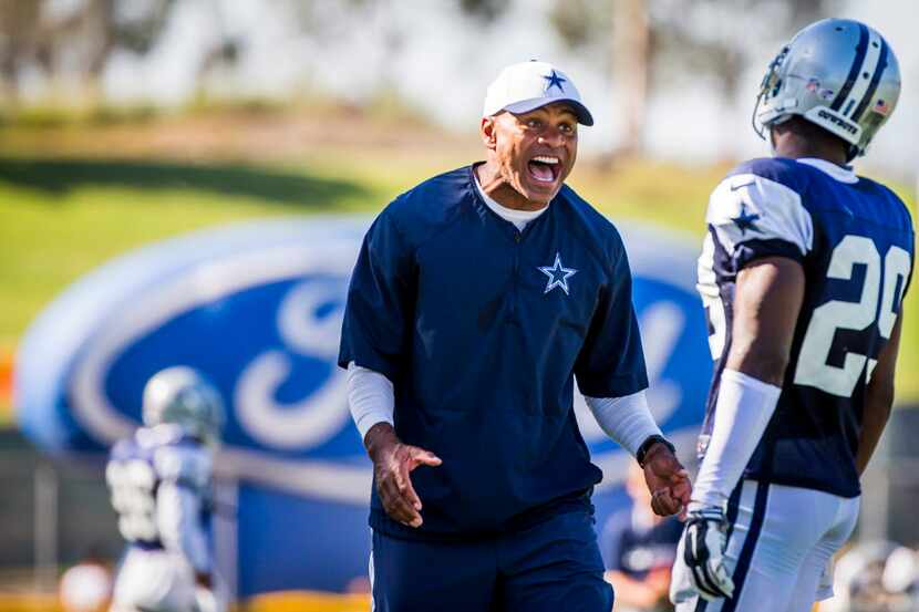 Dallas Cowboys secondary coach Jerome Henderson gets on cornerback Joel Ross during practice...