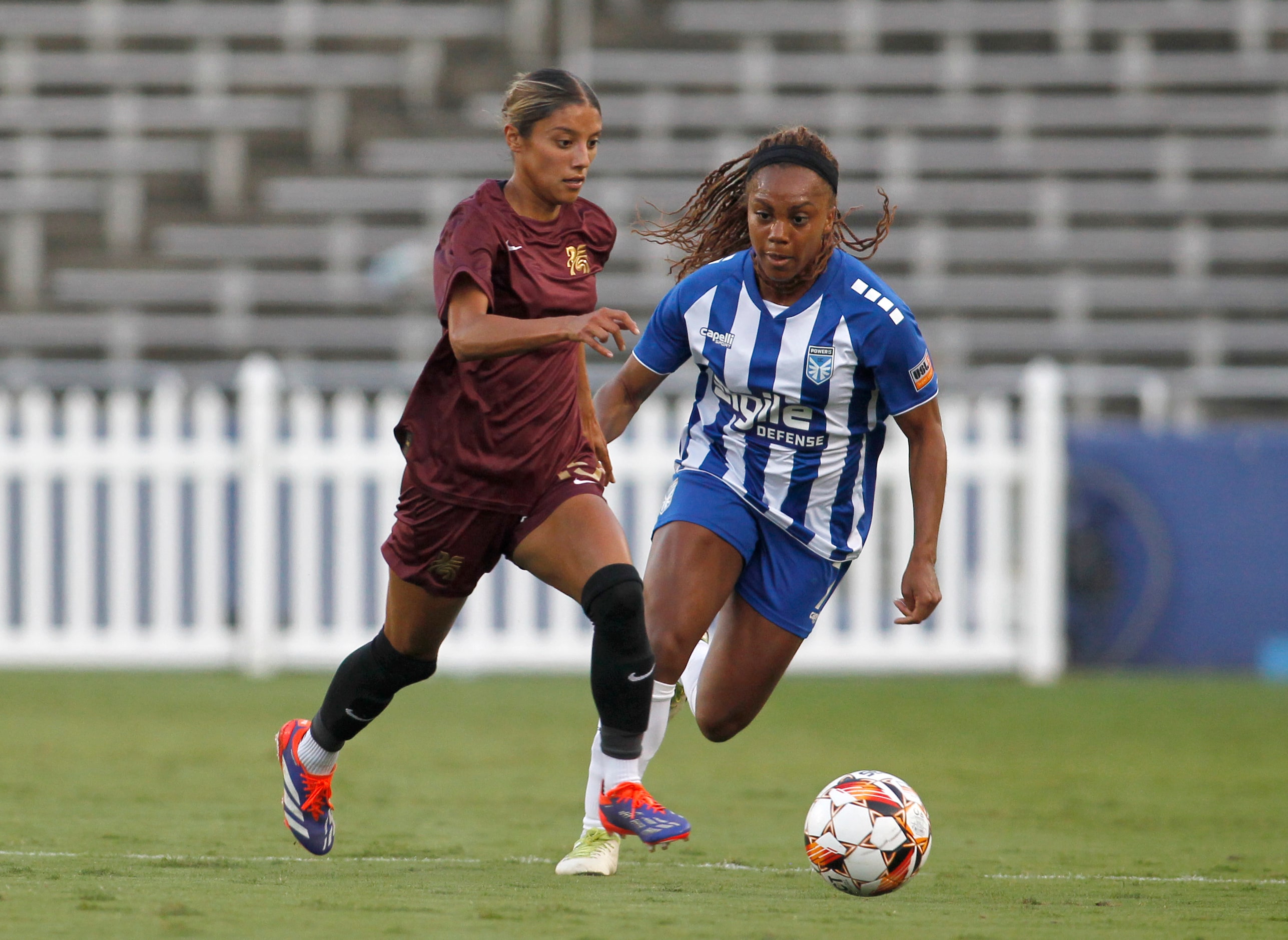 Dallas Trinity FC's Samantha Meza (15), left, controls the ball as DC Power FC's Katelyn...