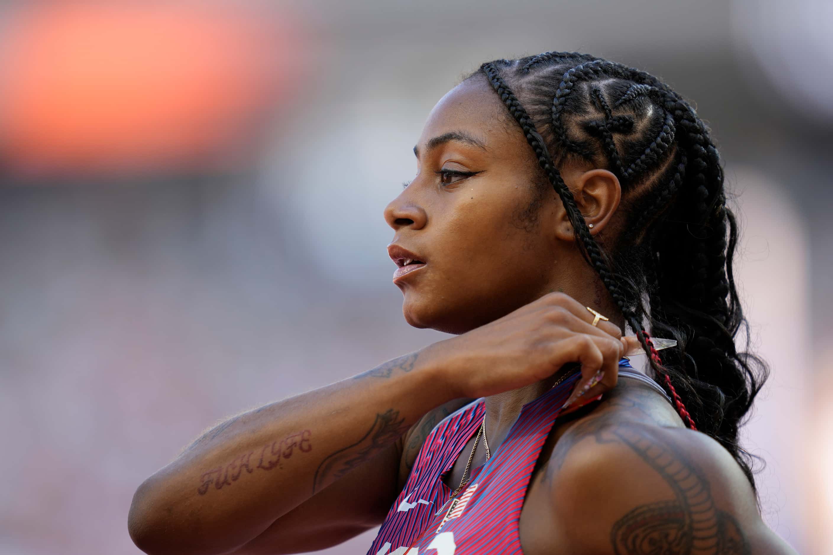 Sha'Carri Richardson, of the United States, reacts after competing in the Women's 100-meters...