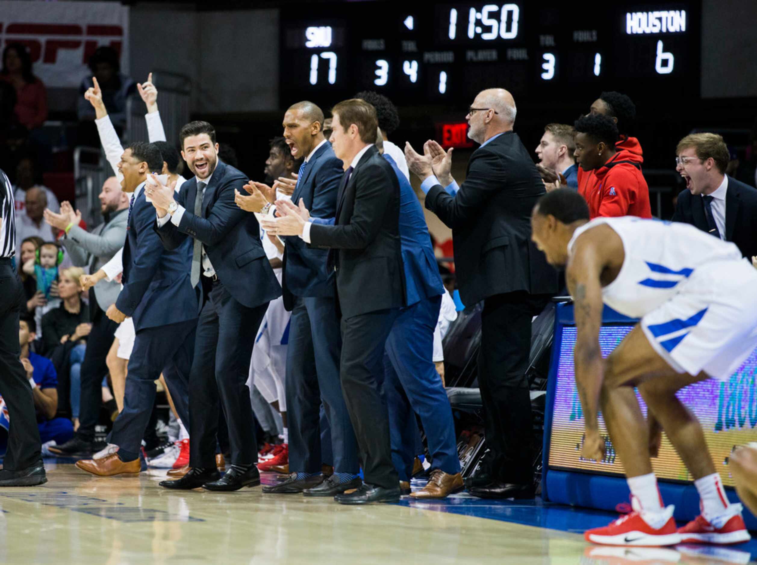 Southern Methodist Mustangs celebrate a point during the first half of a basketball game...