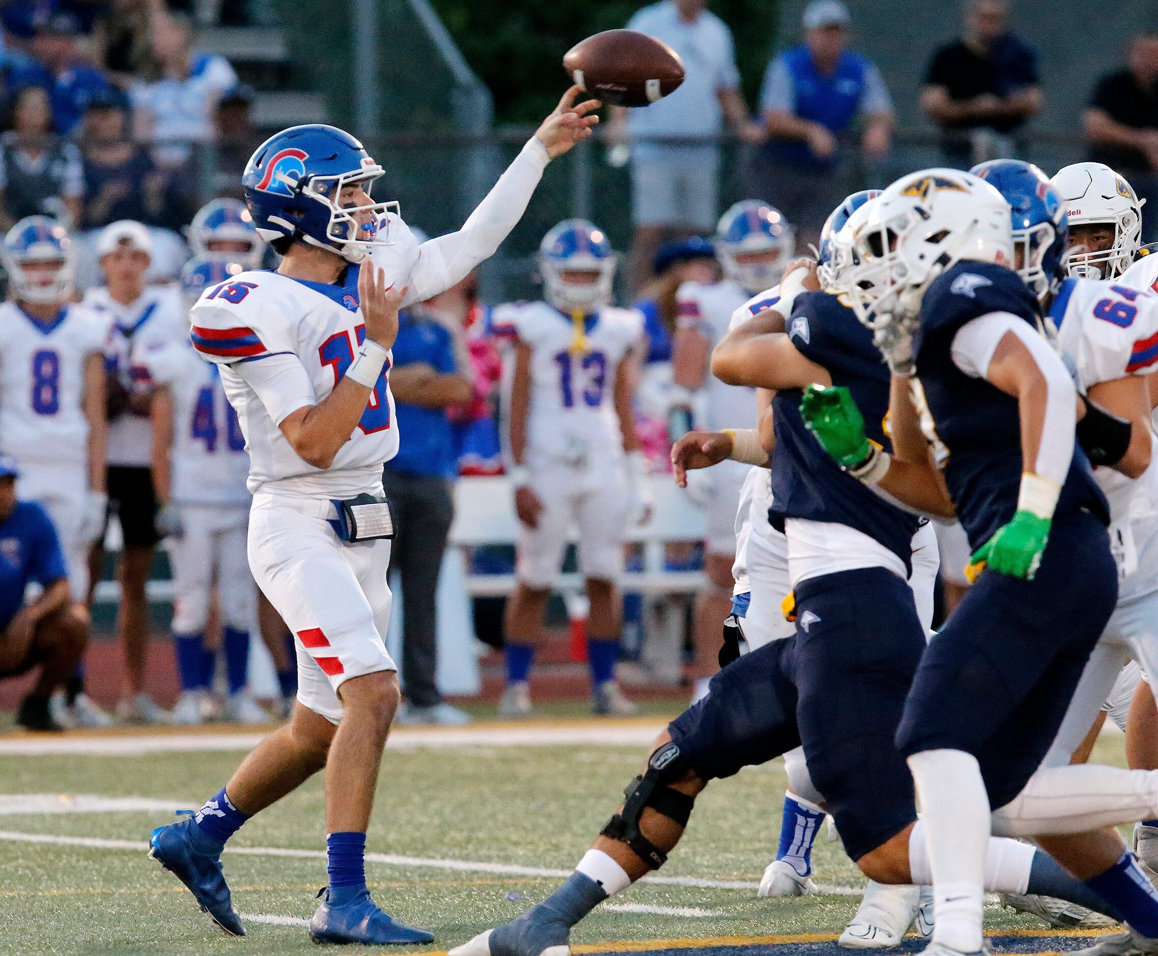 Trinity Christian Academy quarterback Aidan Mills (15) throws a pass during the first half...