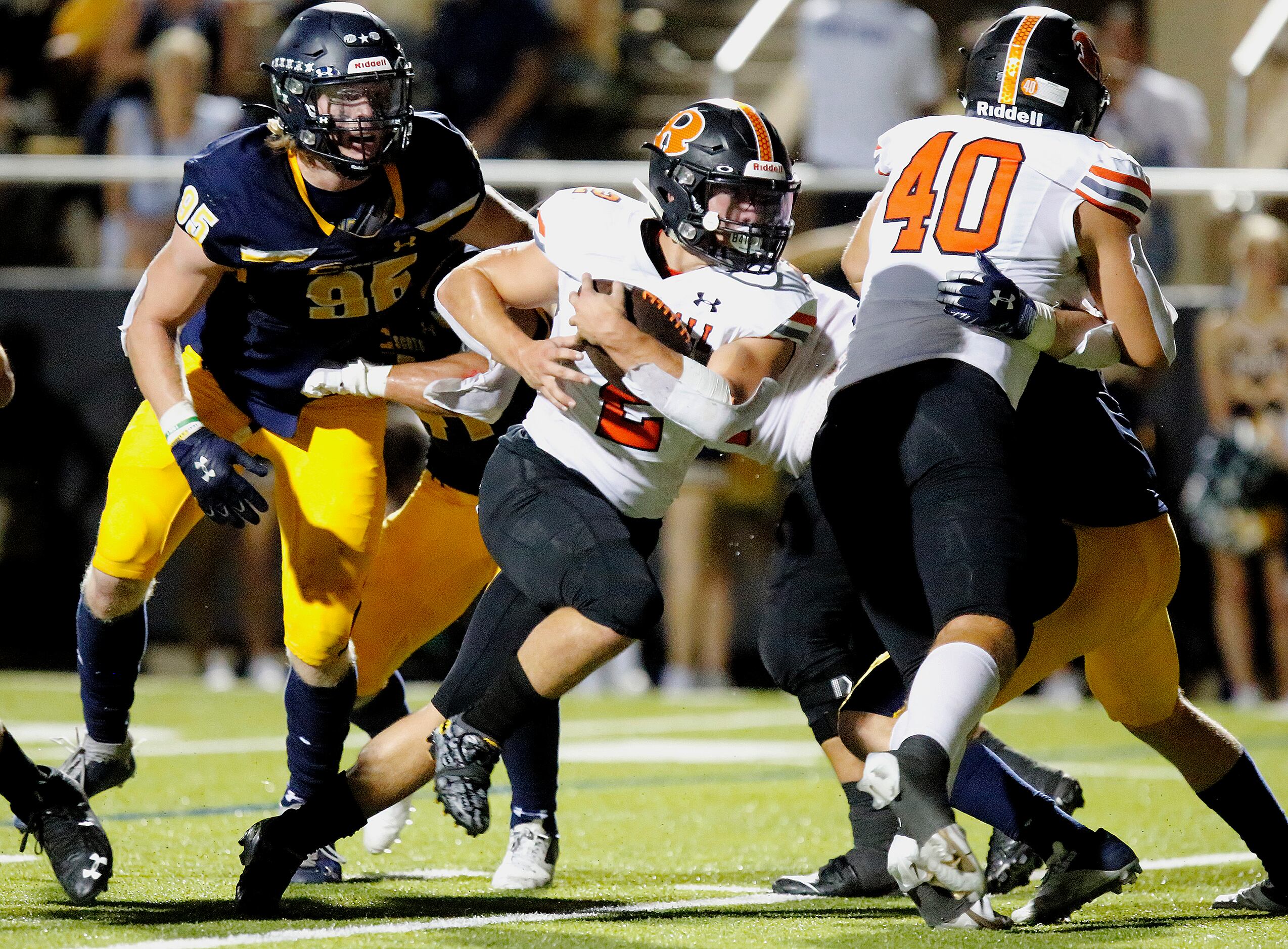 Rockwall High School running back Zach Hernandez (2) carries the ball into the end zone for...
