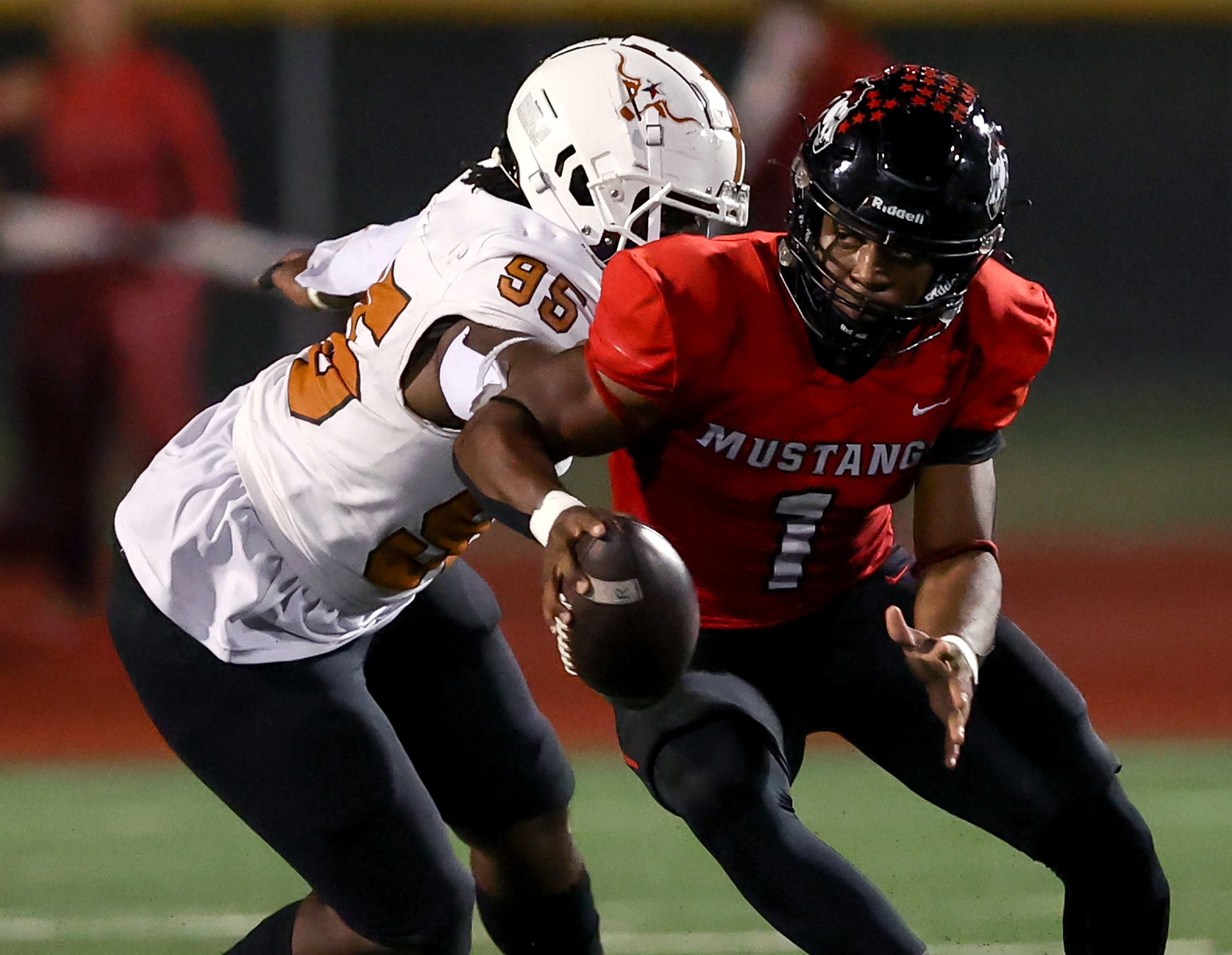 Creekview backup quarterback DeAndre Richardson (1) avoids a sack from W.T. White defensive...