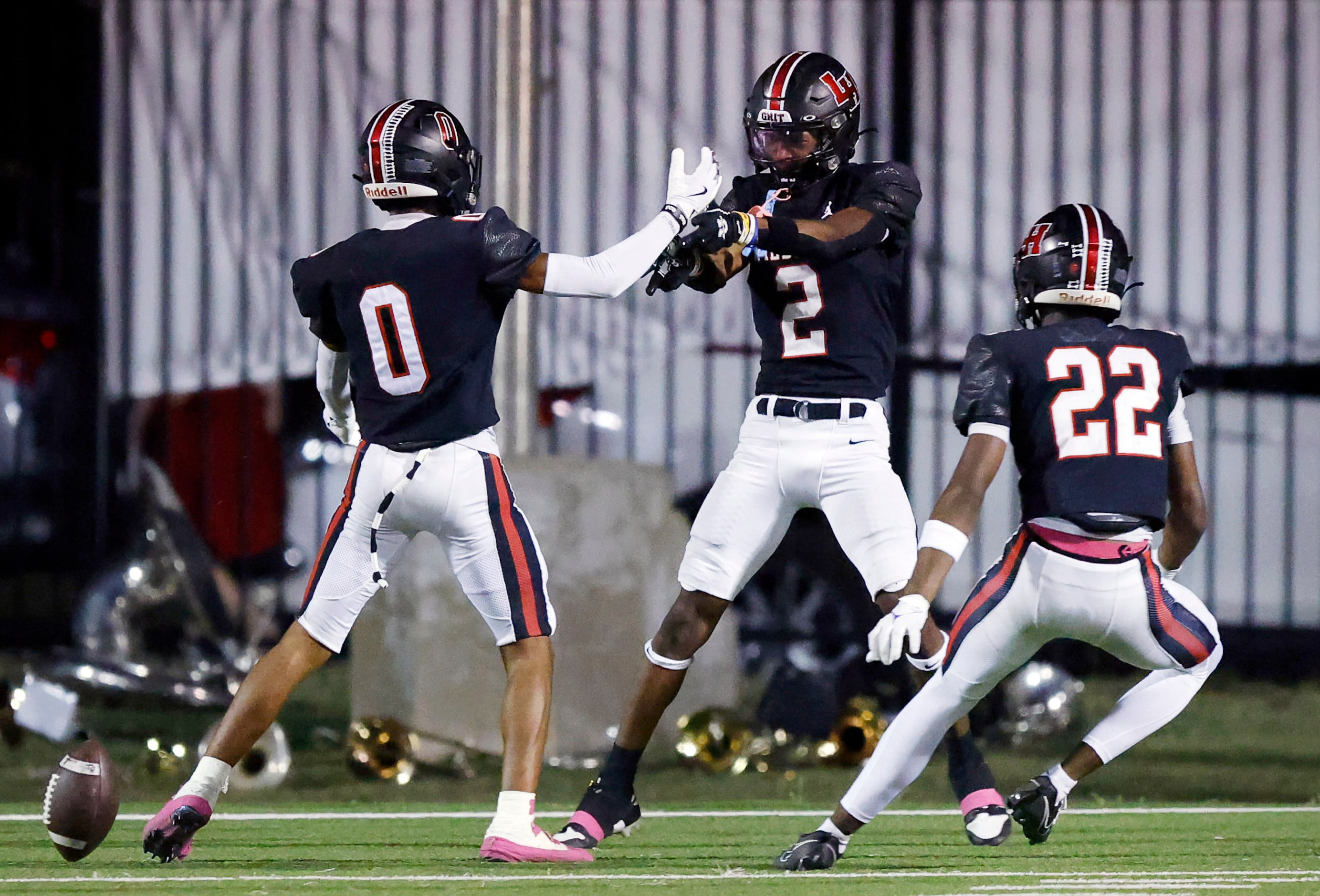 Lake Highlands High defensive back Ayden Webb (2) is congratulated on his first half...