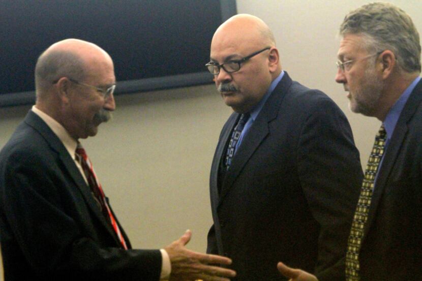 Special prosecutor Ted Steinke (left) shook hands with defense attorney Wayne Lacy as...