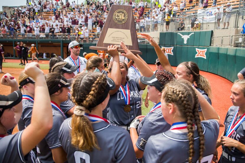 The Colony softball players hold up a state semifinalist trophy after they lost 5-1 in a UIL...